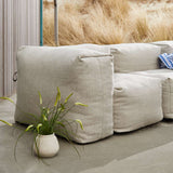 Soft Sofa Outdoor 3-seters sofa i Kirra Sand, myk og formstabil uten ramme for utendørs bruk.