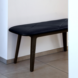Nordic Bench in dark stained oak with Terra Black leather seat, sleek and minimalist design.