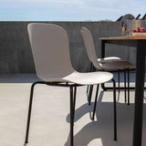 Taupe Patio Chair no. One S1 with black powder-coated steel frame in outdoor setting
