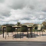Patio Chair no. One S2 i olivengrønt plastskall med svart pulverlakkert stålunderstell utendørs.