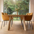 Edge Dining Table i europeisk eik med fasetterte kanter, 240x100 cm, i lyst rom med stoler rundt.