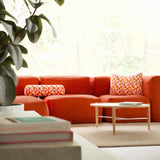 Soft Sofa Indoor lounger in orange jacquard fabric with geometric pattern, soft and flexible design.