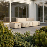 Soft Sofa Outdoor pouf i boucle beige stoff med myk og rund form for utebruk.