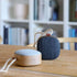Go Wood bærbar høyttaler i røkt eik med tekstil fra KVADRAT, kompakt og trådløs design.