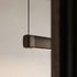 Pebble pendellampe i bronse over et spisebord