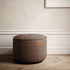 Canvas Pouf i petrolfarget lerretstoff med håndsydde linsting, rund puff i dansk design.