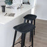 Nordic Bar Stool in black stained oak with Terra Black leather seat and steel footrest.