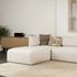 Fjord Sofa pouf i mykt, lyst stoff med skandinavisk design og avrundede kanter.