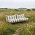 Mollis Lounge Sofa 2-seter i Renesse Taupe med pulverlakkert aluminiumsramme og myke puter.