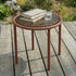 Mollis Side Table Ø50 i chestnut med pulverlakkert aluminiumsramme og røykfarget herdet glass, utendørsbord.