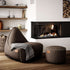 Canvas Lounge Chair og puf i petrol lerretstoff med myk, formstøttende design for innendørs bruk.