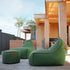 Cobana Lounge Chair and Pouf in Cobana Grey with soft fabric and rounded shape.