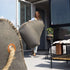 Cobana Lounge Chair og Pouf i grå olefinfiber med rund puf og ryggstøtte, innendørs og utendørs bruk.