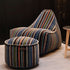 Lounge Chair & Pouf Paul Smith med flerfarget, lineært bomullstrekk i moderne design på lyst gulv