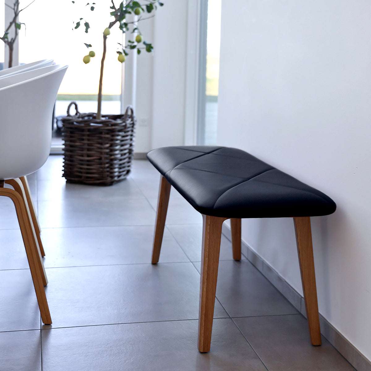 Nordic Bench in oak wood with Terra Black leather seat, minimalist Danish design.