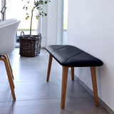 Nordic Bench in oak wood with Terra Black leather seat, minimalist Danish design.