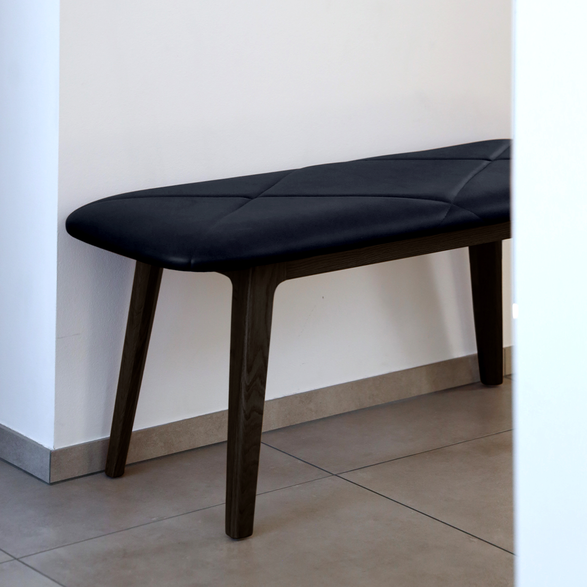 Nordic Bench in dark stained oak with Terra Black leather seat, sleek and minimalist design.