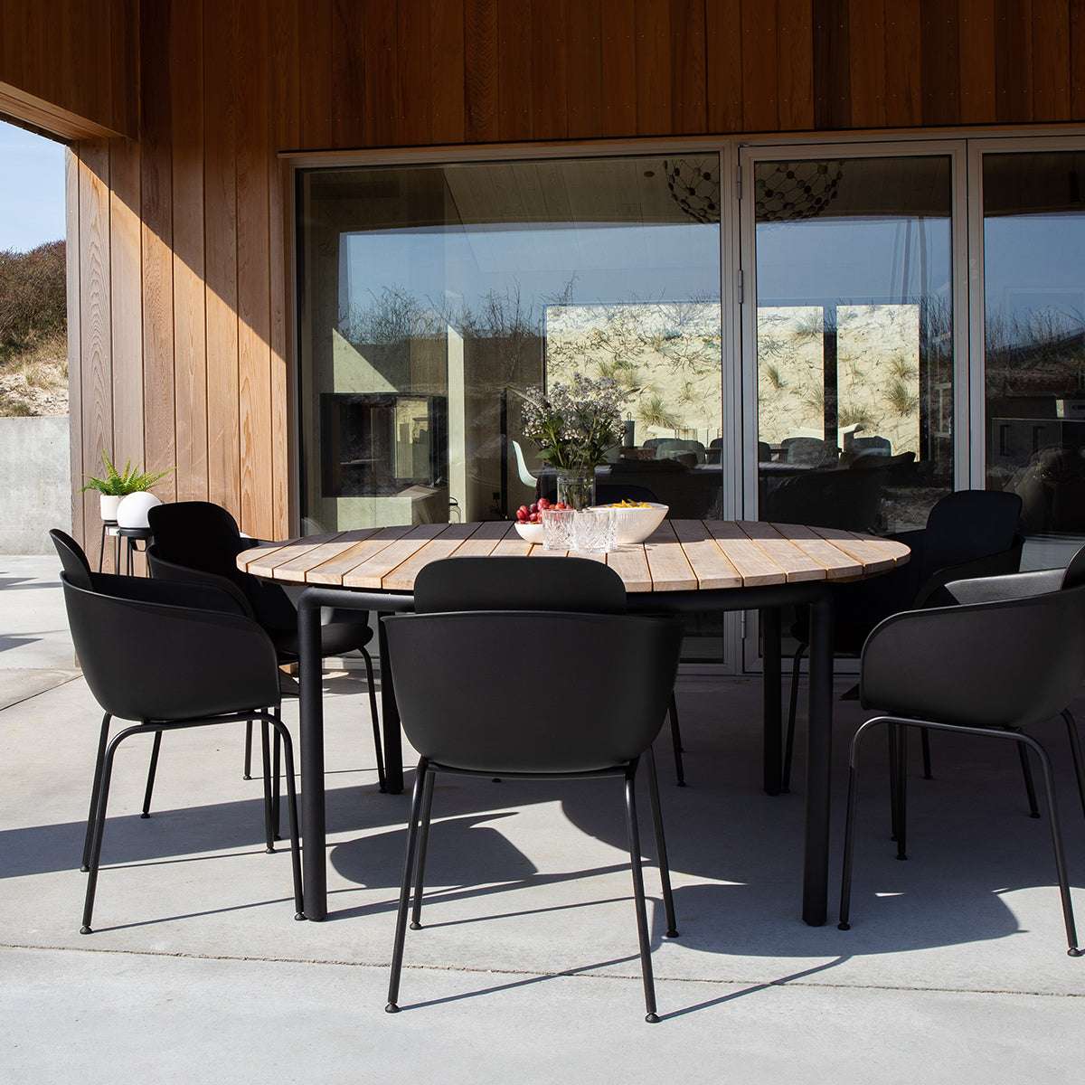Taupe Patio Chair no. One S2 with black frame made of recycled plastic and powder-coated steel for outdoor use
