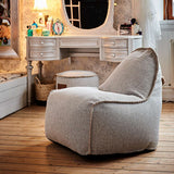 Cobana Junior Lounge Chair og puf i nøytral farge, myk og formstabil barne sakkosekk med rund puf.