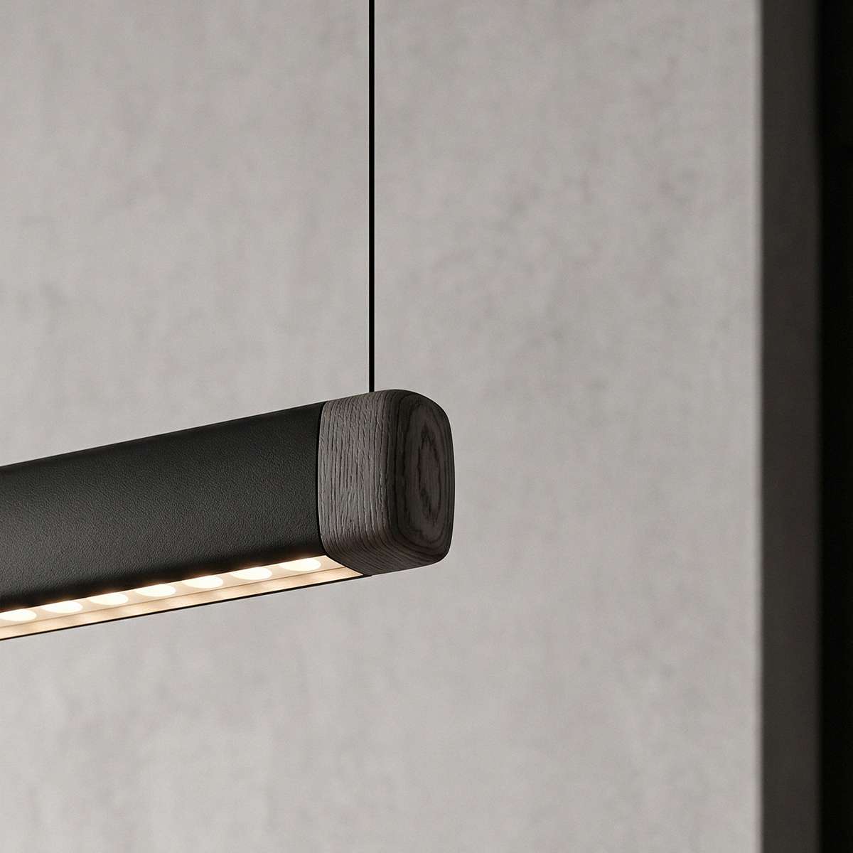 Pebble pendellampe i svart over et spisebord