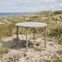 Taupe Kirra Dining Table Ø110 in powder-coated aluminum with teak top for outdoor use