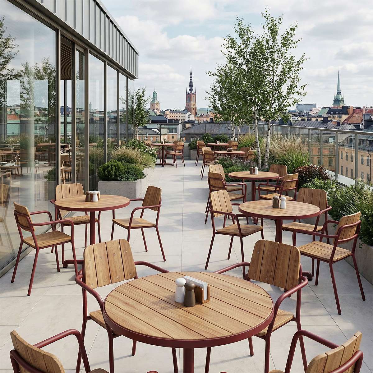 Kirra Café Table utendørs spisebord i pulverlakkert aluminium og ubehandlet teak med rund bordplate.