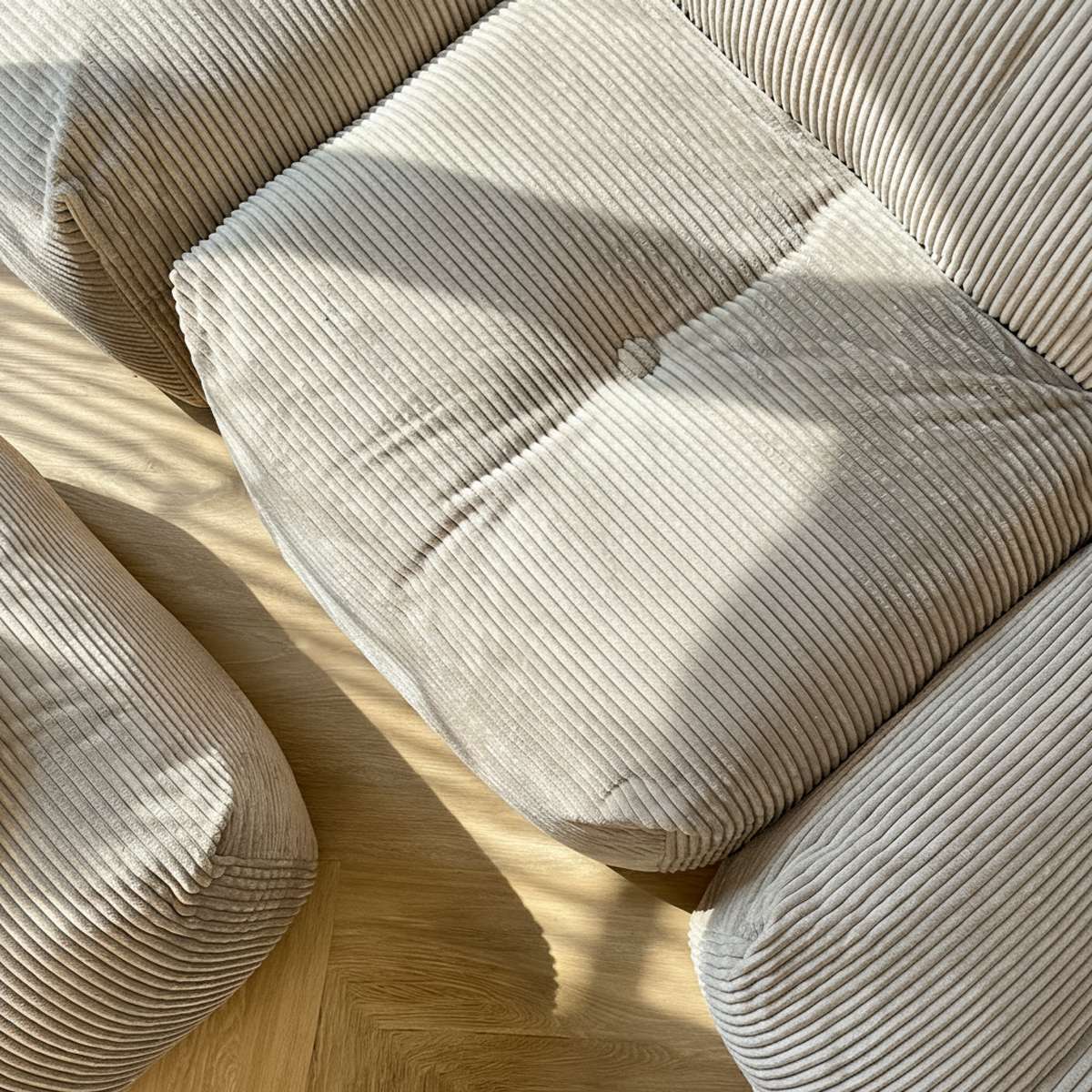 Soft Sofa Indoor lounger in olive green corduroy fabric with soft, cushioned design.