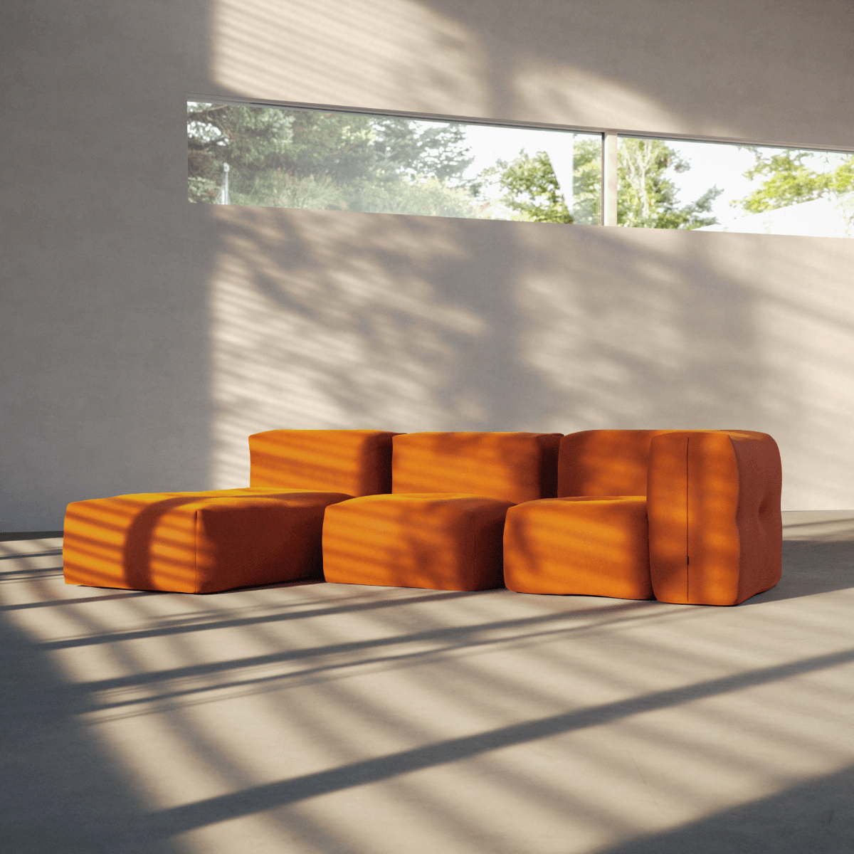 Soft Sofa Indoor Lounger i oransje jaquard stoff med myk, modulær design og lav sittehøyde.