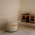 SACKit Pouf Indoor i Teddy Beige stoff, rund og kompakt puf med myk overflate.