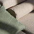 Nærbilde av grønn og beige tekstil på modulbasert utesofa fra sackit med myke puter og skandinavisk design for terrasse og hage